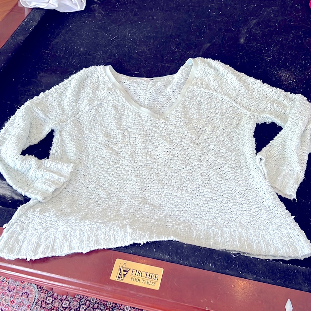 Very very pale blue sweater